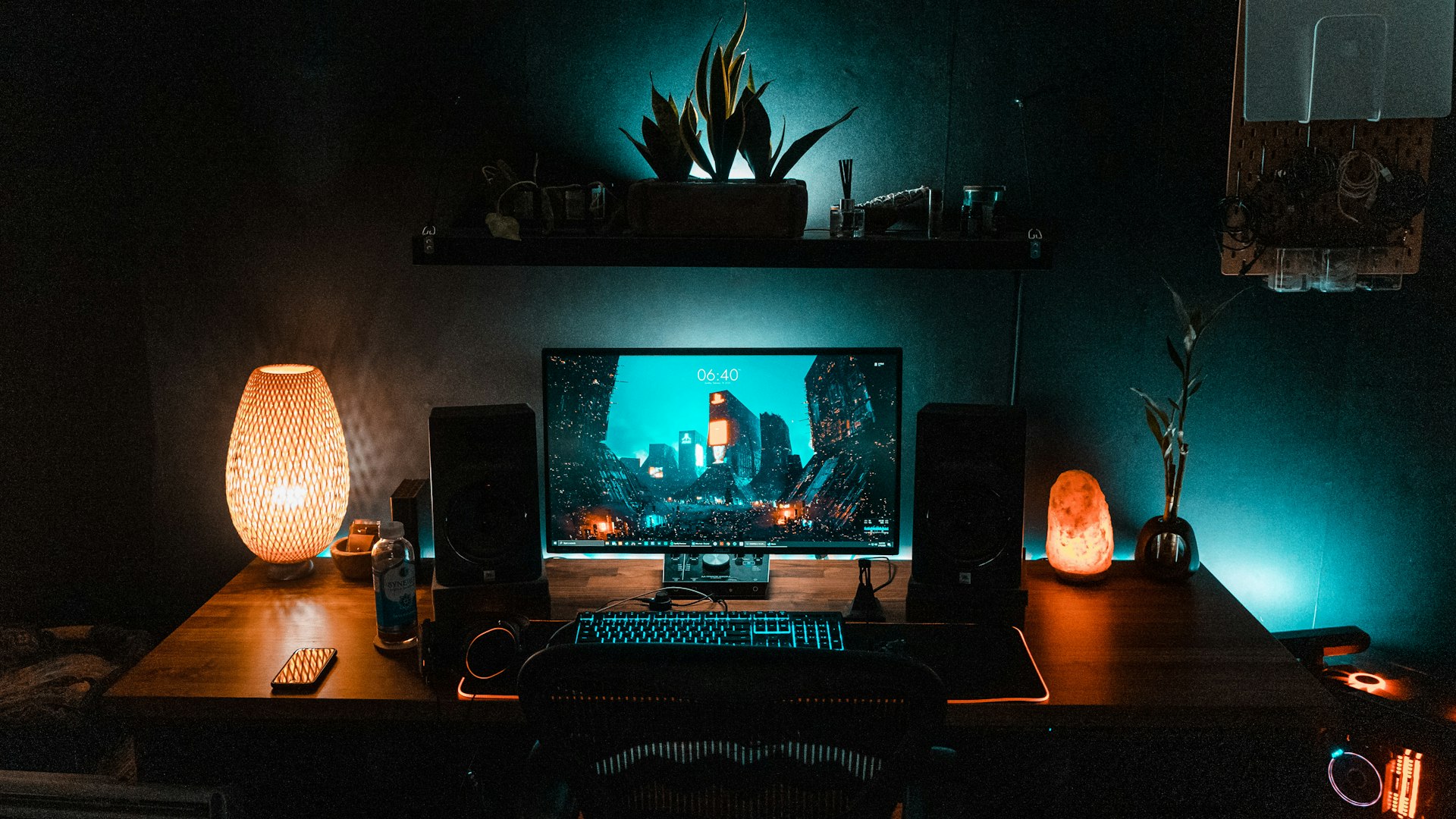 Gaming setup with backlit keyboard and monitor